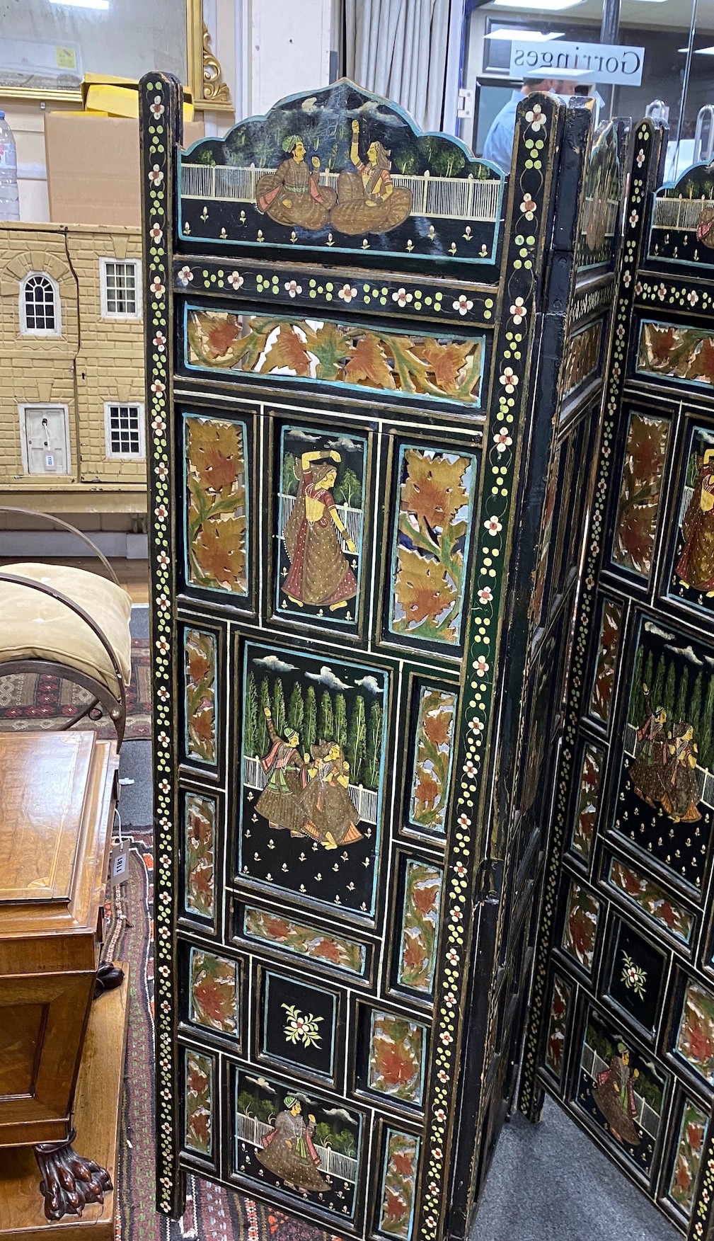 An Indian painted polychrome four fold screen, each panel width 40cm, height 137cm